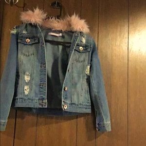 This Jean jacket has not been used it has pink fur on the top of the jacket